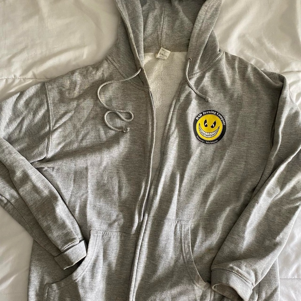 Grey zip up Bad Brewing company hoodie